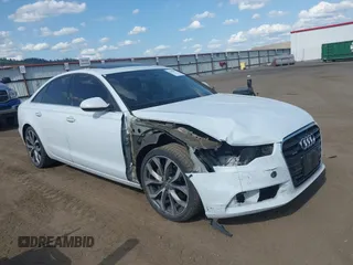 2015 Audi A6 Premium Plus z VIN WAUGFAFC9FN042616, wystawiony jako IAAI lot #42496917 z przebiegiem 100 943 mil mil oraz . Historia ofert i sprzedaży dostępna na DreamBid. Obrazek 1.