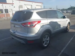 2014 Ford Escape SE with VIN 1FMCU0GX3EUE33604, listed as a IAAI auction lot 42080186 with 149,930 mi miles. Bid and sale history available at carsss.com. Image 4.