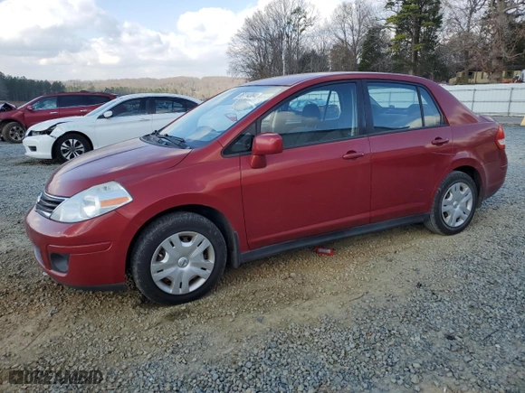 2010 Nissan Versa 1.8 S with VIN 3N1BC1AP2AL433022, listed as a Copart auction lot 86114384 with 180,689 mi miles and Salvage Title. Bid and sale history available at carsss.com. Image 1.