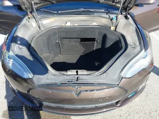 2014 Tesla Model S 60 with VIN 5YJSA1H17EFP33275, listed as a IAAI auction lot 41778167 with 202,749 mi miles and . Bid and sale history available at DreamBid. Image 10.