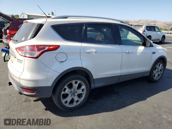 2014 Ford Escape Titanium z VIN 1FMCU0J9XEUD01904, wystawiony jako Copart lot #61819555 z przebiegiem 217 794 mil mil oraz Czysty tytuł • Clean title. Historia ofert i sprzedaży dostępna na DreamBid. Obrazek 3.
