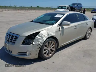 2014 Cadillac XTS Premium with VIN 2G61P5S33E9157607, listed as a IAAI auction lot 42004612 with 111,047 mi miles and . Bid and sale history available at DreamBid. Image 2.
