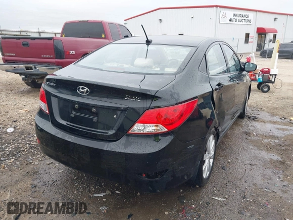 2013 Hyundai Accent GLS with VIN KMHCU4AE9DU379870, listed as a IAAI auction lot 41534029 with 102,610 mi miles. Bid and sale history available at carsss.com. Image 4.