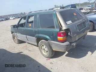 1996 Jeep Grand Cherokee Laredo with VIN 1J4FX58S9TC300710, listed as a IAAI auction lot 42073391 with 1 mi miles. Bid and sale history available at carsss.com. Image 3.