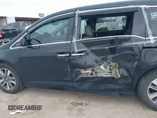 2014 Honda Odyssey Touring with VIN 5FNRL5H9XEB045695, listed as a IAAI auction lot 41545348 with 131,472 mi miles and . Bid and sale history available at carsss.com. Image 14.