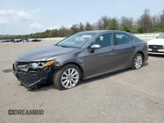 2018 Toyota Camry LE with VIN 4T1B11HK1JU141022, listed as a Copart auction lot 60135785 with 112,652 mi miles and Salvage title. Bid and sale history available at DreamBid. Image 1.
