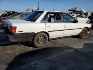 1990 Toyota Camry z VIN JT2SV21E3L0349179, wystawiony jako Copart lot #75125234 z przebiegiem 138 635 mil mil oraz Czysty tytuł • Clean title. Historia ofert i sprzedaży dostępna na DreamBid. Obrazek 3.