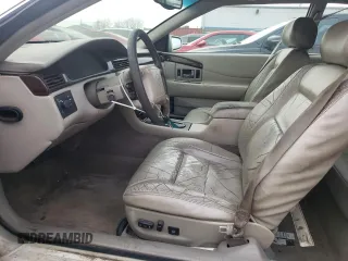 1999 Cadillac Eldorado z VIN 1G6EL12Y5XU600699, wystawiony jako Copart lot #88164505 z przebiegiem 140 075 mil mil oraz Szkoda całkowita • Salvage title. Historia ofert i sprzedaży dostępna na DreamBid. Obrazek 7.
