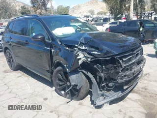 2021 Volkswagen Tiguan SE with VIN 3VV3B7AX0MM015825, listed as a IAAI auction lot 41955268 with 57,909 mi miles and . Bid and sale history available at DreamBid. Image 1.