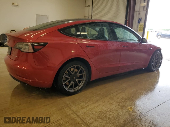 2022 Tesla Model 3 Long Range with VIN 5YJ3E1EBXNF285779, listed as a Copart auction lot 54630135 with 129,097 mi miles and Clean Title. Bid and sale history available at DreamBid. Image 3.