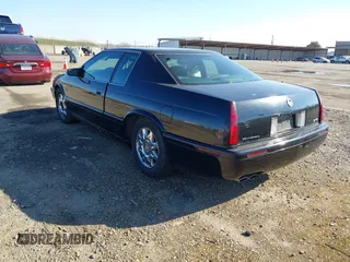 2001 Cadillac Eldorado Touring ETC z VIN 1G6ET12961B100627, wystawiony jako IAAI lot #41458966 z przebiegiem 113 620 mil mil oraz . Historia ofert i sprzedaży dostępna na DreamBid. Obrazek 3.