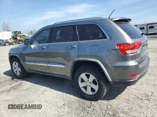 2011 Jeep Grand Cherokee Laredo with VIN 1J4RR4GGXBC702300, listed as a Copart auction lot 49736255 with 163,684 mi miles and Salvage Title. Bid and sale history available at carsss.com. Image 2.