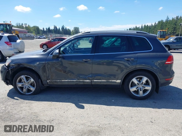 2012 Volkswagen Touareg Sport with VIN WVGFK9BP0CD004951, listed as a IAAI auction lot 42724125 with 173,993 mi miles and . Bid and sale history available at DreamBid. Image 14.