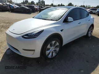2023 Tesla Model Y Long Range z VIN 7SAYGDEE2PA128486, wystawiony jako Copart lot #53906275 z przebiegiem 28 148 mil mil oraz Szkoda całkowita • Salvage title. Historia ofert i sprzedaży dostępna na DreamBid. Obrazek 1.