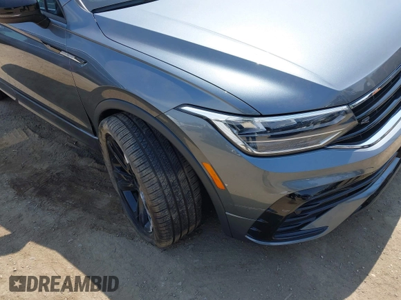 2023 Volkswagen Tiguan SE R-Line Black with VIN 3VVCB7AX8PM036684, listed as a IAAI auction lot 42169004 with 25,024 mi miles and . Bid and sale history available at DreamBid. Image 6.