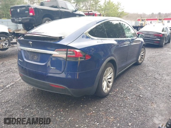 2016 Tesla Model X 70D with VIN 5YJXCBE20GF016173, listed as a IAAI auction lot 41809725 with 116,198 mi miles. Bid and sale history available at carsss.com. Image 4.