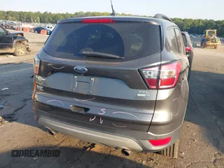 2018 Ford Escape SEL with VIN 1FMCU9HD0JUC25036, listed as a IAAI auction lot 40518589 with 143,076 mi miles. Bid and sale history available at carsss.com. Image 16.