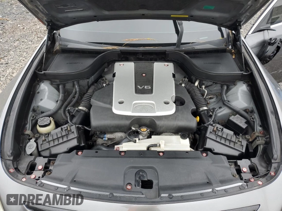 2012 Infiniti G25 x z VIN JN1DV6AR5CM862018, wystawiony jako Copart lot #57133395 z przebiegiem 129 829 mil mil oraz Szkoda całkowita • Salvage title. Historia ofert i sprzedaży dostępna na DreamBid. Obrazek 11.