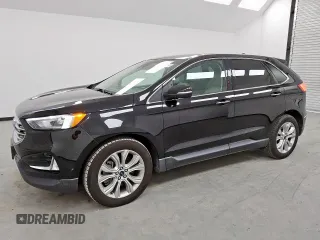 2021 Ford Edge Titanium with VIN 2FMPK4K94MBA27083, listed as a Copart auction lot 62149285 with 128,325 mi miles and Clean title. Bid and sale history available at DreamBid. Image 1.