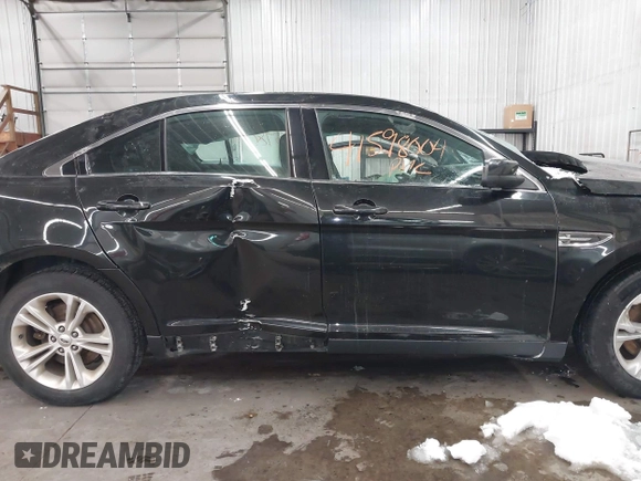 2015 Ford Taurus SEL with VIN 1FAHP2E81FG181897, listed as a IAAI auction lot 41598004 with Not Provided miles and . Bid and sale history available at carsss.com. Image 14.