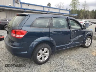 2013 Dodge Journey American Value with VIN 3C4PDCAB6DT577273, listed as a Copart auction lot 50627295 with 139,775 mi miles and Salvage title. Bid and sale history available at DreamBid. Image 3.