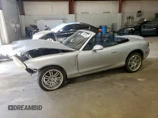 2003 Mazda MX-5 Miata Cloth with VIN JM1NB353130301353, listed as a Copart auction lot 62948325 with 65,054 mi miles and Salvage title. Bid and sale history available at DreamBid. Image 1.