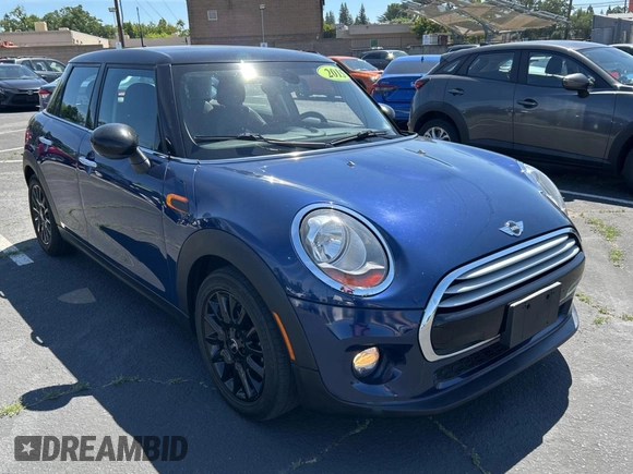 2015 MINI Hardtop 4 Door with VIN WMWXS5C5XFT831166, listed as a Copart auction lot 56714285 with 69,668 mi miles and Salvage Title. Bid and sale history available at DreamBid. Image 1.