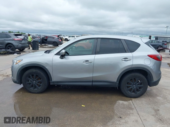 2014 Mazda CX-5 Touring z VIN JM3KE2CY8E0369145, wystawiony jako IAAI lot #42462985 z przebiegiem 155 480 mil mil oraz . Historia ofert i sprzedaży dostępna na DreamBid. Obrazek 14.