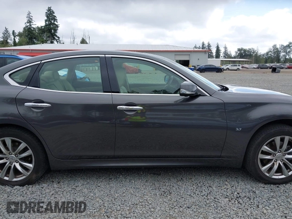 2015 Infiniti Q70 with VIN JN1BY1ARXFM562111, listed as a IAAI auction lot 42473521 with 123,212 mi miles and . Bid and sale history available at DreamBid. Image 13.