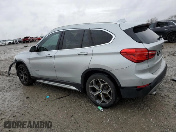 2017 BMW X1 sDrive28i with VIN WBXHU7C33H5H34013, listed as a Copart auction lot 38409444 with 87,558 mi miles and Salvage Title. Bid and sale history available at carsss.com. Image 2.