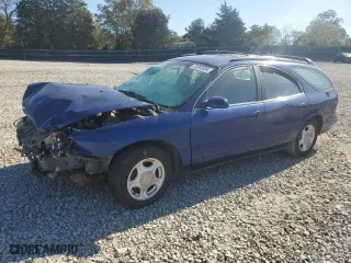 1997 Ford Taurus GL with VIN 1FALP57U2VA153212, listed as a Copart auction lot 75761034 with 167,802 mi miles and Salvage Title. Bid and sale history available at carsss.com. Image 1.