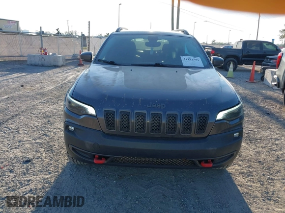 2019 Jeep Cherokee Trailhawk with VIN 1C4PJMBX3KD246100, listed as a IAAI auction lot 41191581 with 98,124 mi miles and . Bid and sale history available at DreamBid. Image 12.