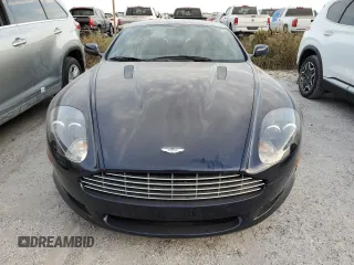2009 Aston Martin DB9 z VIN SCFAD01E79GA12139, wystawiony jako Copart lot #76241164 z przebiegiem Nie podano mil oraz Szkody całkowita. Historia ofert i sprzedaży dostępna na DreamBid. Obrazek 5.