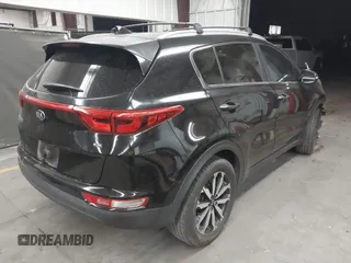 2018 Kia Sportage EX with VIN KNDPN3AC5J7353577, listed as a IAAI auction lot 42058456 with 156,783 mi miles and . Bid and sale history available at DreamBid. Image 4.