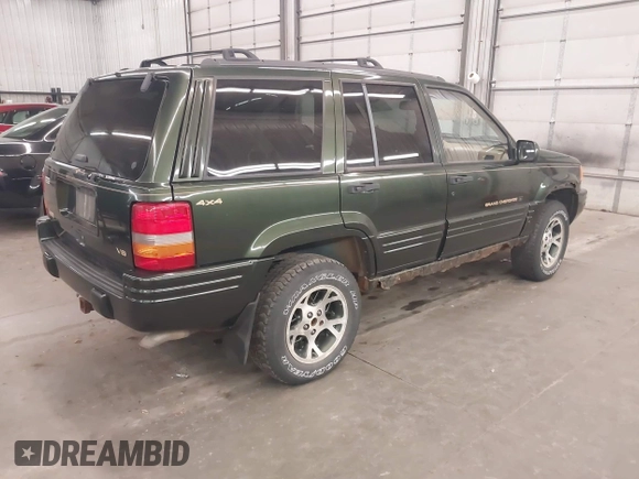 1997 Jeep Grand Cherokee Limited with VIN 1J4GZ78Y0VC684023, listed as a IAAI auction lot 42090436 with 310,831 mi miles. Bid and sale history available at carsss.com. Image 4.