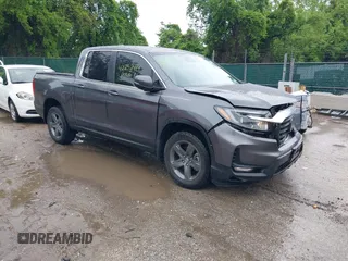 2023 Honda Ridgeline RTL with VIN 5FPYK3F5XPB030014, listed as a IAAI auction lot 42252414 with 87,059 mi miles and . Bid and sale history available at DreamBid. Image 1.