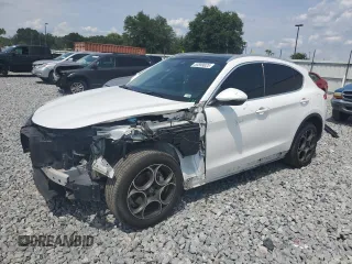 2018 Alfa Romeo Stelvio Ti z VIN ZASFAKBN8J7B79495, wystawiony jako Copart lot #55599025 z przebiegiem 143 606 mil mil oraz Szkoda całkowita • Salvage title. Historia ofert i sprzedaży dostępna na DreamBid. Obrazek 1.