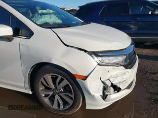 2022 Honda Odyssey Touring with VIN 5FNRL6H85NB058948, listed as a IAAI auction lot 42579157 with 53,669 mi miles and . Bid and sale history available at DreamBid. Image 6.