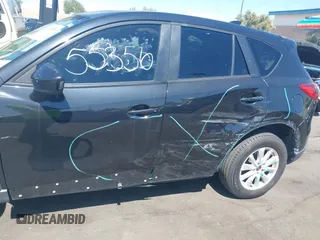 2013 Mazda CX-5 Touring with VIN JM3KE2CEXD0153589, listed as a IAAI auction lot 41855356 with 86,030 mi miles and . Bid and sale history available at DreamBid. Image 6.