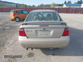 2007 Ford Focus S z VIN 1FAHP34N87W351757, wystawiony jako IAAI lot #42076181 z przebiegiem 212 301 mil mil oraz . Historia ofert i sprzedaży dostępna na DreamBid. Obrazek 16.