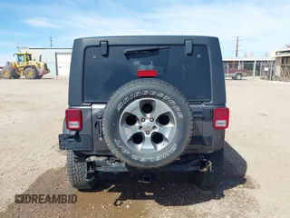2017 Jeep Wrangler Unlimited Sahara with VIN 1C4BJWEG7HL641347, listed as a IAAI auction lot 41833356 with 84,735 mi miles. Bid and sale history available at carsss.com. Image 17.