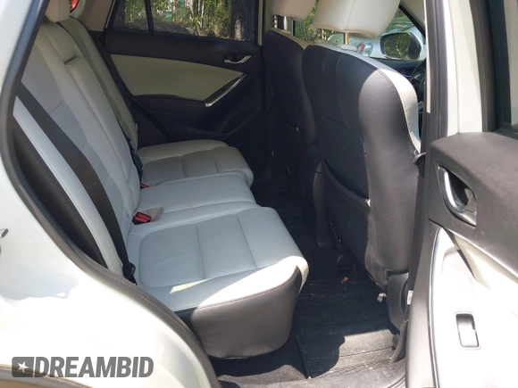 2016 Mazda CX-5 Grand Touring with VIN JM3KE2DY0G0870077, listed as a IAAI auction lot 42158225 with 93,816 mi miles. Bid and sale history available at carsss.com. Image 8.