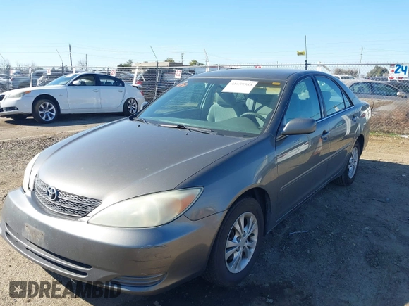 2004 Toyota Camry LE with VIN 4T1BF30K74U588368, listed as a IAAI auction lot 41659383 with 190,833 mi miles. Bid and sale history available at carsss.com. Image 2.