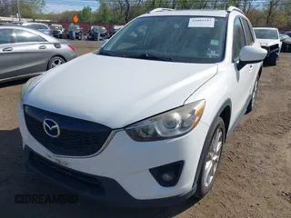 2013 Mazda CX-5 Grand Touring with VIN JM3KE4DE3D0156957, listed as a IAAI auction lot 42085443 with 146,990 mi miles. Bid and sale history available at carsss.com. Image 6.