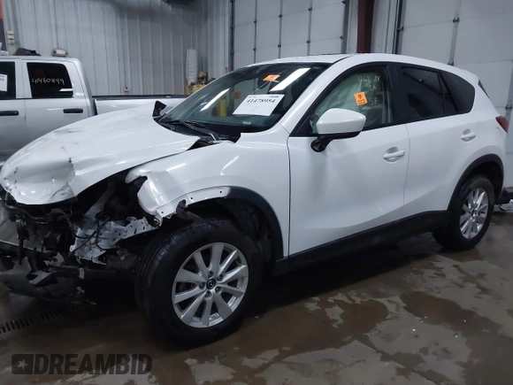 2014 Mazda CX-5 Touring with VIN JM3KE4CY4E0349034, listed as a IAAI auction lot 41478954 with 117,502 mi miles. Bid and sale history available at carsss.com. Image 17.
