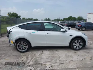2023 Tesla Model Y Long Range z VIN 7SAYGDEE0PA065534, wystawiony jako IAAI lot #42445868 z przebiegiem 22 638 mil mil oraz . Historia ofert i sprzedaży dostępna na DreamBid. Obrazek 13.
