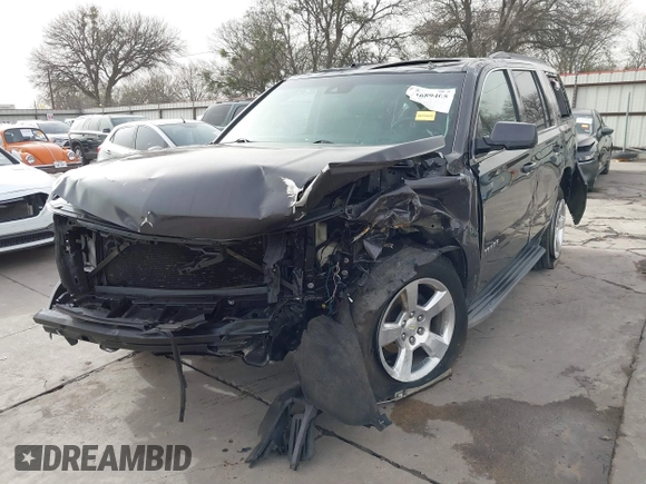 2015 Chevrolet Tahoe LT with VIN 1GNSCBKC5FR504459, listed as a IAAI auction lot 41689405 with 141,783 mi miles and . Bid and sale history available at DreamBid. Image 2.