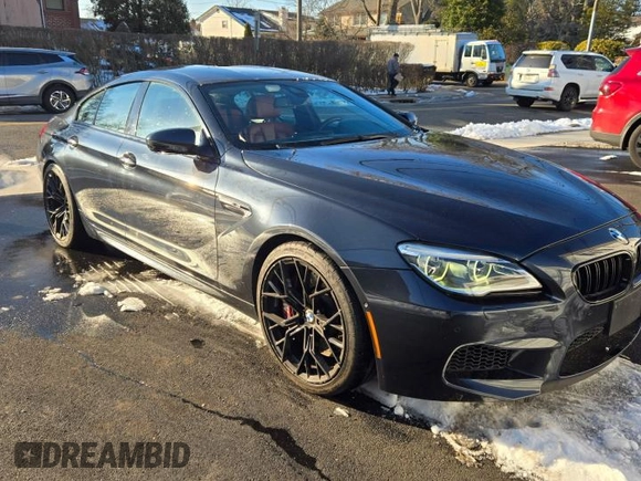 2016 BMW M6 z VIN WBS6E9C57GG437138, wystawiony jako Copart lot #45290525 z przebiegiem 58 645 mil mil oraz Tytuł czysty. Historia ofert i sprzedaży dostępna na DreamBid. Obrazek 1.