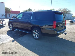 2017 Chevrolet Suburban Premier with VIN 1GNSKJKC0HR114398, listed as a IAAI auction lot 41745611 with 211,906 mi miles. Bid and sale history available at carsss.com. Image 3.