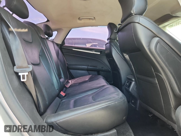 2016 Ford Fusion Titanium z VIN 3FA6P0K95GR220171, wystawiony jako Copart lot #64980565 z przebiegiem 202 852 mil mil oraz Czysty tytuł • Clean title. Historia ofert i sprzedaży dostępna na DreamBid. Obrazek 10.